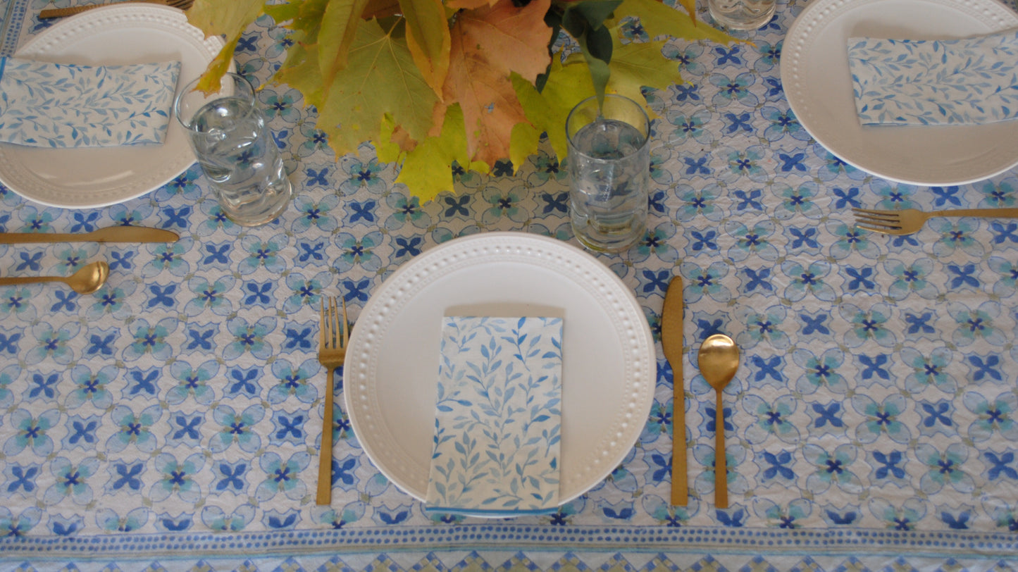 blue and white paper dinner napkins with blue leaves pattern.
